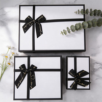 Boîte cadeau portable de luxe personnalisée avec doublure en éponge, gaufrage, papier d'art écologique recyclable, design avec ruban