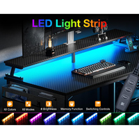 Bureau de jeu RGB en forme de L, grand bureau d'angle pour e-sport, table de jeu pour ordinateur, fabricant de bureaux pour PC gamer noirs avec prises électriques