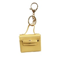 Mini porte-clés en cuir |   Porte-cartes et porte-monnaie de couleur unie avec breloques |   Logo personnalisable