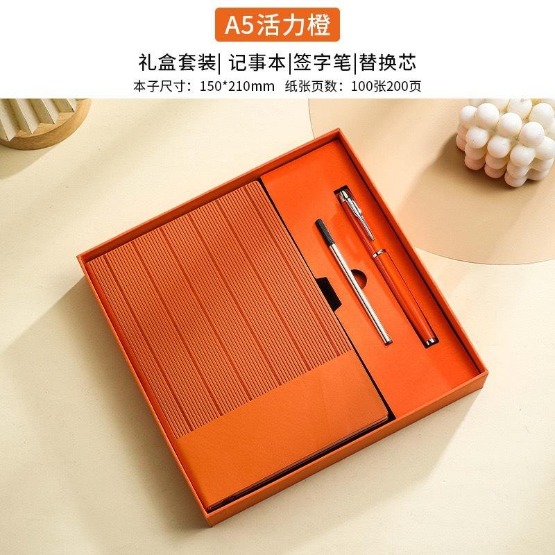 Caja de regalo con bolígrafo de firma, recarga de naranja y bolsa de regalo.