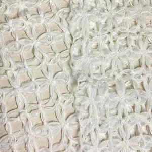 New arrival 100% polyester 180gsm comfortable hollow out pure white floral pattern sequins embroidery fabric for wedding dress