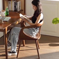 Chaise de salle à manger en bois massif noyer noir avec dossier et accoudoirs, style capsule spatiale multifonctionnelle, pour usage domestique ou bureau, style mi-siècle