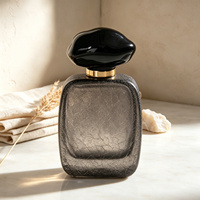Flacon de parfum en verre personnalisé avec logo, 50 ml, texture glace craquelée, gris anthracite avec capuchon noir brillant, étiquette privée, vente en gros