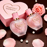 Flacon de parfum élégant en verre givré en forme de cœur avec accents dorés, logo personnalisé, support OEM ODM