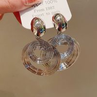 Boucles d'oreilles pendantes plaquées or à double anneau, anti-allergiques, très tendance pour femme