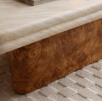 Table basse créative en travertin et placage de bois de burl, design moderne, texture naturelle pour salons et espaces latéraux.