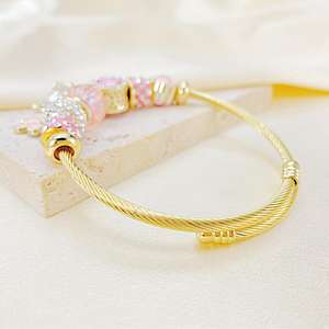 <span class=keywords><strong>Bracelet</strong></span> jonc unisexe <span class=keywords><strong>en</strong></span> acier inoxydable plaqué or 18 carats avec pendentif papillon et ours, orné de cristaux et de perles, pour une mode tendance - Product Image 2