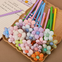 Nouveau stylo gel neutre créatif en forme de fleur, mignon et coloré, mini-fleur très stylée, stylo de signature à secouer et à presser, 0,5 mm, en plastique