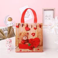 Sac fourre-tout non tissé d'épicerie imprimé au détail de logo personnalisé conception d'ours de cadeau de la Saint-Valentin pour des achats pratiques