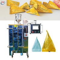 Machine à emballer automatique de sachet de pâte de tomate de bâton de miel de forme de triangle avec l'impression de date