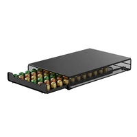 Conception métallique robuste et performante avec finition poudrée de qualité industrielle, noir mat moderne, capacité de 60 capsules