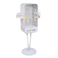 Cage à oiseaux ventilée en métal avec base robuste, découpes décoratives, support au sol stable, fermeture à bouton, style simple