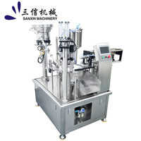 Machine automatique de remplissage et de bouchage de sachets à double bec verseur pour liquides, pâtes, cosmétiques, lotions et savons