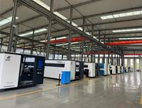 Machine de découpe laser à fibre Tuosheng CNC 6000W/3000W avec plateforme d'échange, conception entièrement fermée, commande Cypcut, grande table de travail