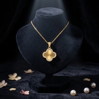 Collier pendentif trèfle à quatre feuilles en acier inoxydable plaqué or 18 carats avec diamants incrustés, design filigrané, chaîne en bambou pour femme Dongguan