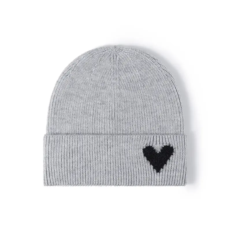 Wholesale girls fashion beanie with heart logo cute skully caps softer winter hat knit beanie cap with plush brim for women