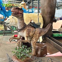 Aire de jeux de parc d'attractions pour enfants avec tour de dinosaures en plein air grandeur nature avec tour réaliste en silice à pièces sur dinosaure Raptor