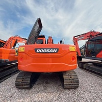 Excavadora de cadenas usada Doosan DX140LCA de alto rendimiento y bajo costo con tren de rodaje estable para proyectos de construcción en carreteras y limpieza de terrenos