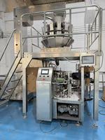 Machine de remplissage et de scellage automatique rotative YH pour sachets préformés à fermeture éclair Doypack pour aliments et boissons