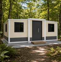 Casa Contenedor Plegable Expandible con Diseño de Ladrillo Crema, Puerta y Marco Negros para Glamping en el Bosque