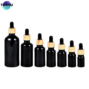 Hot sale screw cap essence liquid wholesale 1 ounce 100 50 30 ml empty custom black dropper pump essential oil glass bottle