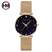 Hannah Martin Montre à cadran pailleté bleu ciel étoilé pour femme Bracelet en maille d'acier inoxydable minimaliste Seiko Quartz 1 an en alliage de verre
