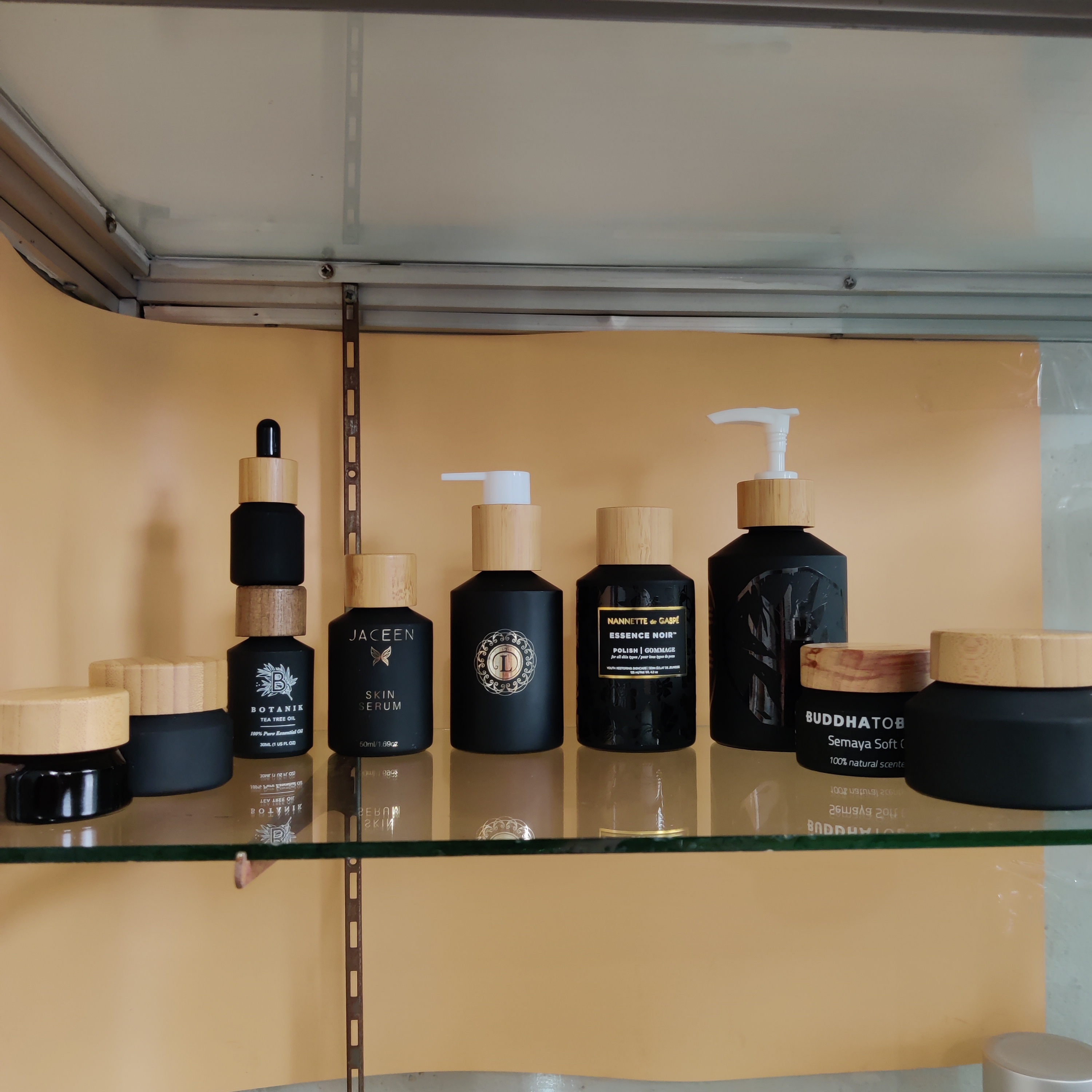 Cosmetic packaging slant shoulder matte black skin care set glass bottle cosmetic products with black dropper and jar with lid