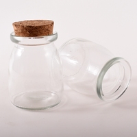 Usine personnalisée 100ML 150ML 200ML 300ML Bouteille en verre de luxe ronde avec couvercle en liège transparent pour pouding