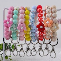 Niedliches Blumen-Silikon-Perlenarmband mit Blumendruck, elastisches Schlüsselband, Handtaschenanhänger, Damen-Taschenaccessoire