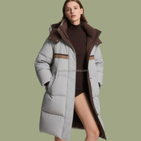Manteau matelassé pour femme en duvet de canard blanc 90% ODM, avec blocs de couleur personnalisés OEM, long, à capuche, pour l'hiver, de créateur, fabrication usine