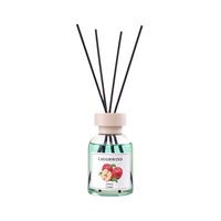 Diffuseur de parfum d'ambiance sans flamme aux arômes fruités, série fruits d'intérieur, en verre coloré, avec bâtonnets cylindriques en bois