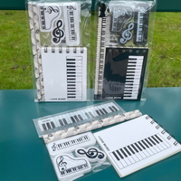 Spezielles Musik-Schreibwarenset für den Außenhandel: Klavier-Musiknoten-Radiergummi, Spiralblock, Bleistift, Geschenktasche, Kombinationsset
