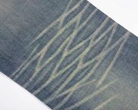 Vêtements de rue pour hommes de haute qualité Pantalons évasés avec broderie croisée de charpentier orange Jeans de détresse pour hommes