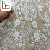 Nouveau design de tissu en dentelle française brodée, tissu en dentelle perlée, tissu en dentelle à paillettes pour robes de mariée pour femmes