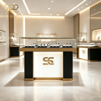 Vitrine de présentation de bijoux en acier inoxydable doré sur mesure avec éclairage LED pour bijouterie