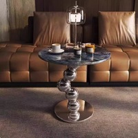 Table basse moderne en pierre frittée avec structure en acier inoxydable argenté – Design durable, écologique et pratique pour votre salon