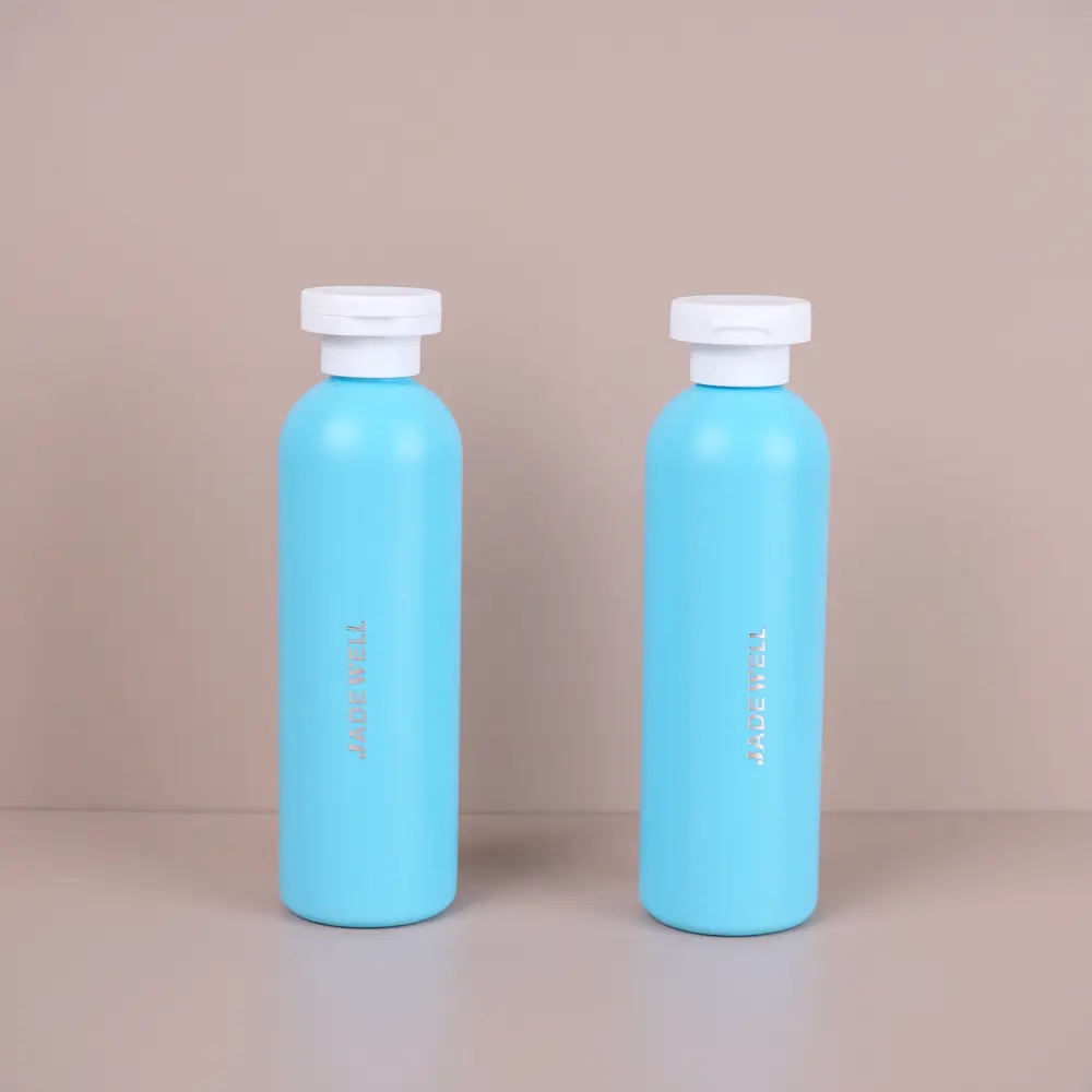 زجاجة شامبو زرقاء 250 مل ناعمة مستديرة HDPE مبيعات من المصنع مباشرة، زجاجة غسول جسم ضغط فارغة بغطاء قلاب