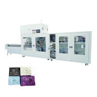 Machine d'emballage automatique de serviettes hygiéniques 65 sacs/min