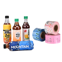 Étiquette de manchon thermorétractable de film rétractable en PVC de qualité alimentaire personnalisée en usine pour l'emballage de bouteille d'eau de jus de café