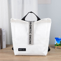Sacs-cadeaux en papier pour boutiques de luxe Logo imprimé de marque personnalisé Poignée en toile et coton Design élégant pour jeunes hommes femmes