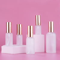 Emballage cosmétique bon marché noir mat or argent couvercles parfum rechargeable chambre vaporisateur bouteille en verre 100ml