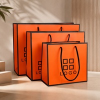 Sac cadeau de luxe en papier couché imprimé avec logo personnalisé, avec poignée en corde, orange et noir, pour emballage de sacs shopping en papier d'art