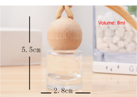 Nouveau modèle de flacon de parfum pour voiture de 8 ml, diffuseur de parfum portable pour voiture, flacon vide avec boule, couvercle en bois, corde suspendue