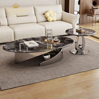 Table basse de salon moderne italienne de luxe léger, avec pieds en acier inoxydable argenté et plateau en pierre frittée ovale