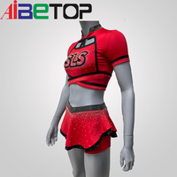 Service OEM personnalisé : Ensemble d'uniformes de cheerleading en strass, comprenant un crop top à manches courtes et dos croisé, une jupe et un short, en Polyester Spandex, avec logo d'équipe