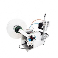 Machine d'étiquetage de bouteilles rondes pneumatique semi-automatique à fonctionnement facile pour les boissons