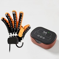 Gants robotiques de qualité supérieure Dispositif de rééducation électrique des mains pour les patients en hémiplégie Massage électrique des doigts