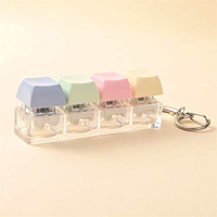 Pendentif de clavier 4 touches en plastique Macaron, couleurs assorties, pour décompression par pression des doigts, idéal pour la décoration de sacs à dos