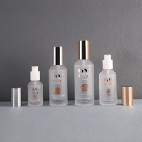 Nouveauté Flacons en verre givrés à pompe à lotion à épaule inclinée Emballage de soins de la peau avec pompe dorée 30ml 50ml 75ml 100ml 200ml