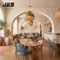 Ensemble table et chaises de restaurant J2S Hotel Design, sièges rembourrés en forme de baril, surface en bois ovale, solutions modernes pour les usines.